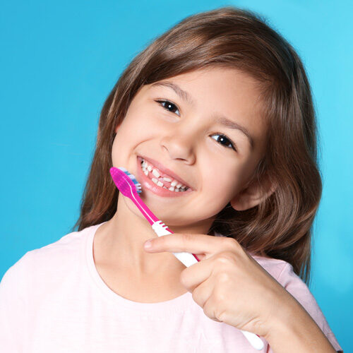 Little girl miling after dental cleaning