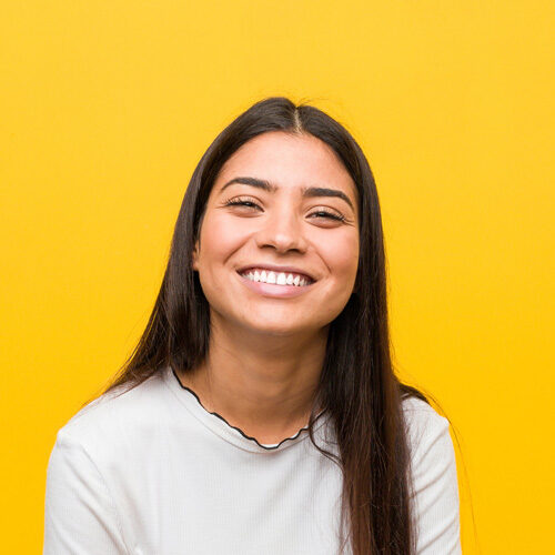 Teenage Woman Smiling Big After Nerve Treatments