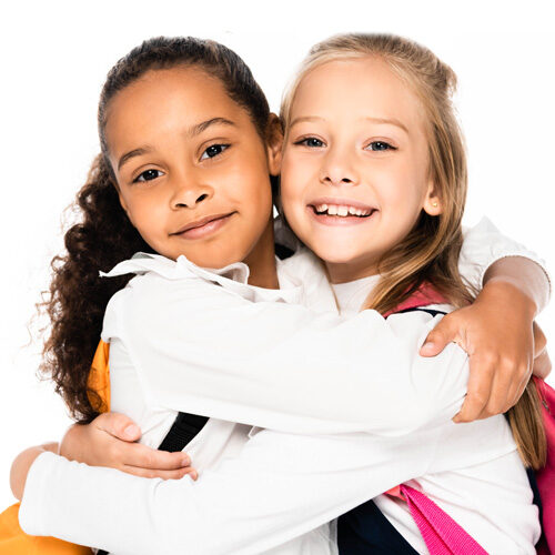 Two Young Girls Smiling and Hugging